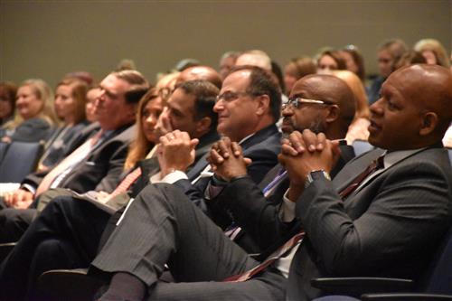 Board and Dr. Nichols watching the guest speaker perform on his piano